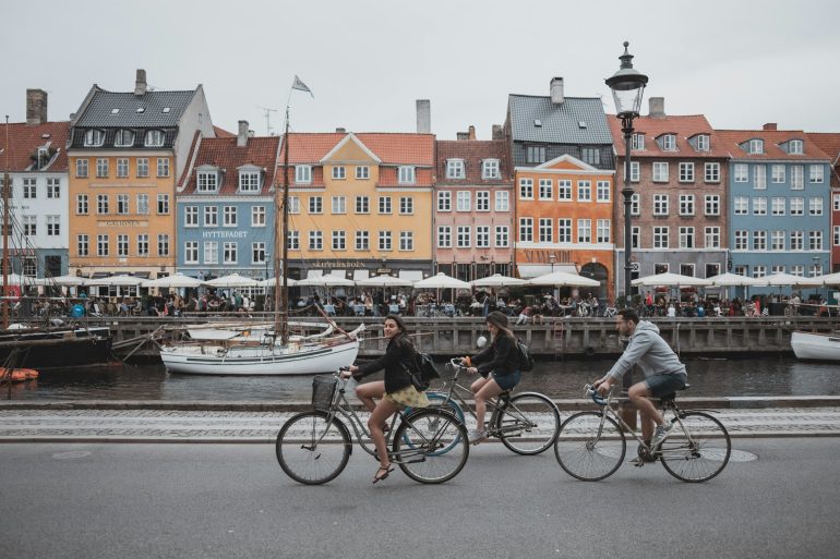 three-people-riding-bicycles